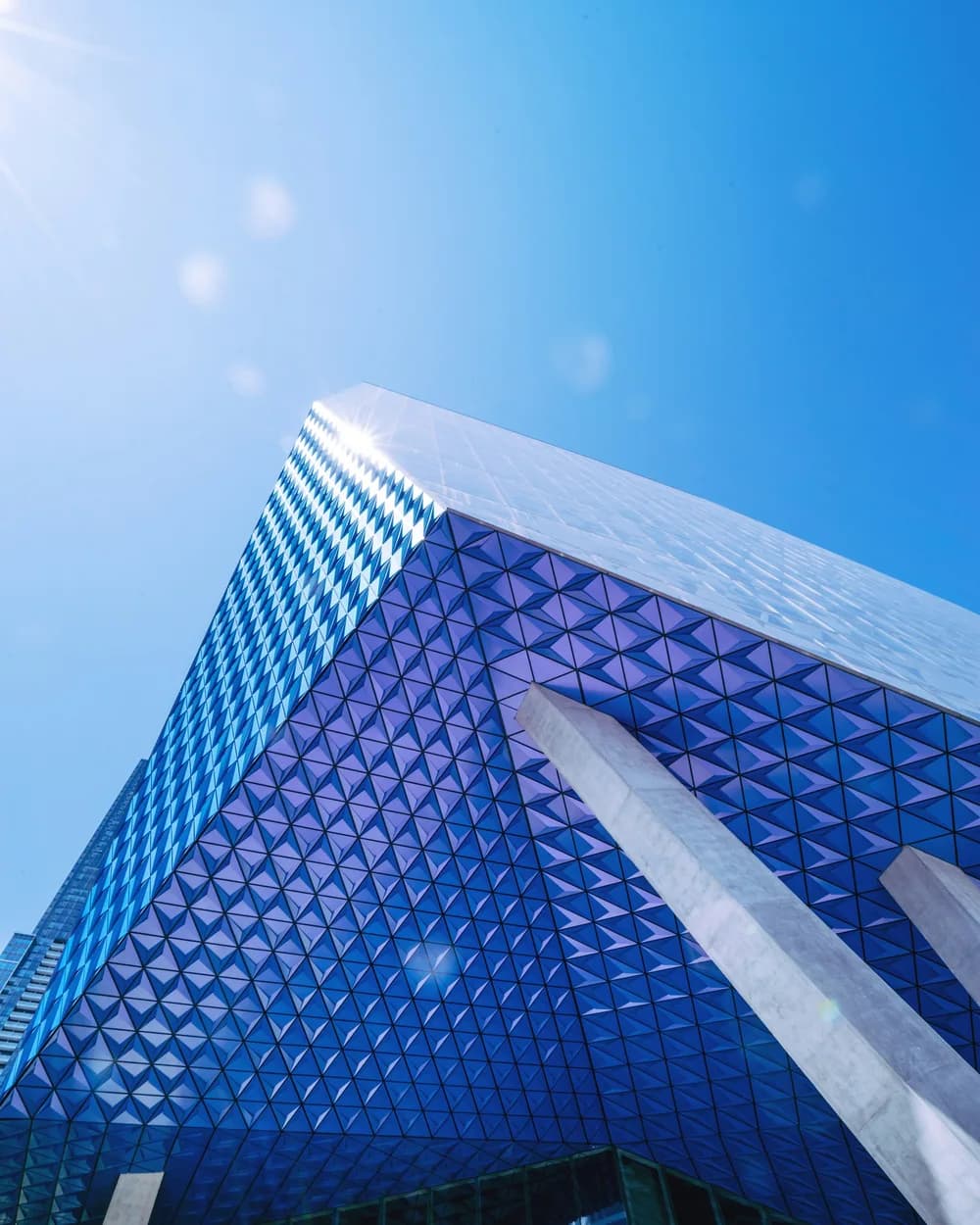 Blue glass architecture against a clear sky